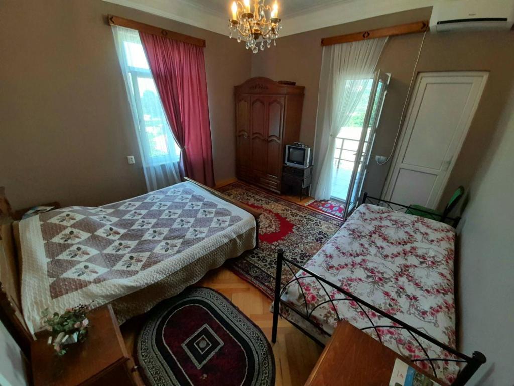 Postel nebo postele na pokoji v ubytování Kemeni Garden
