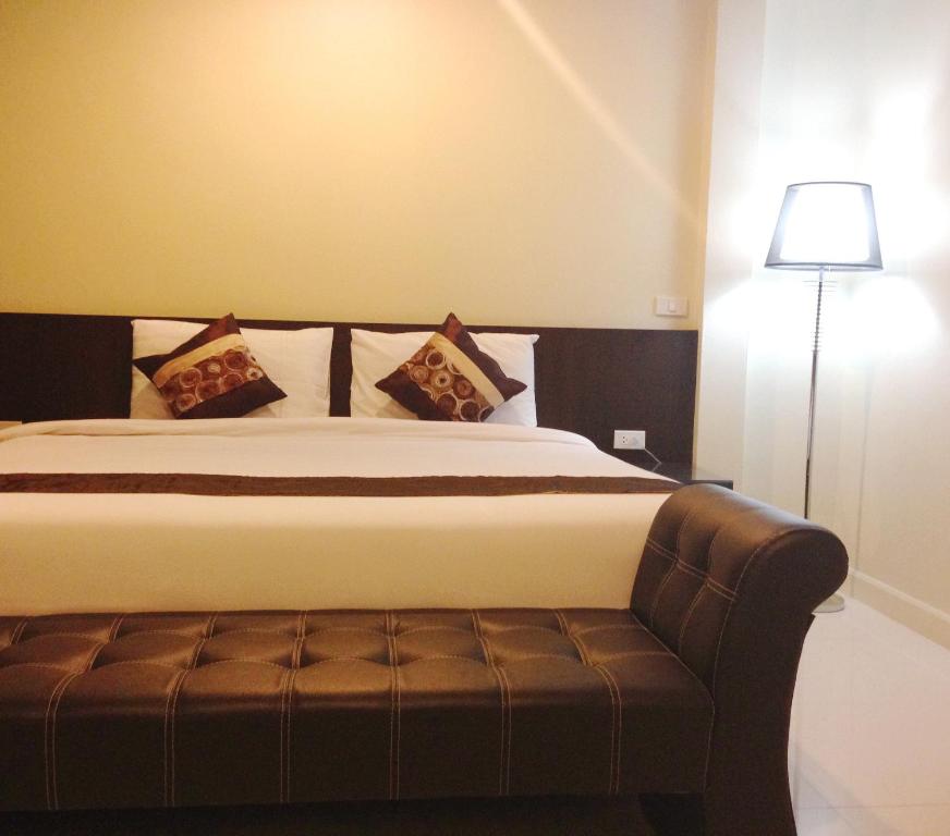 Postel nebo postele na pokoji v ubytování Chiangrai Green Park Resort
