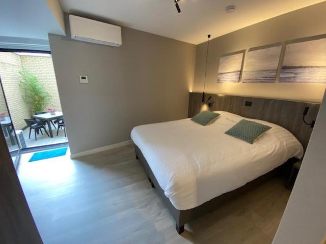 Postel nebo postele na pokoji v ubytování Hotel Princess