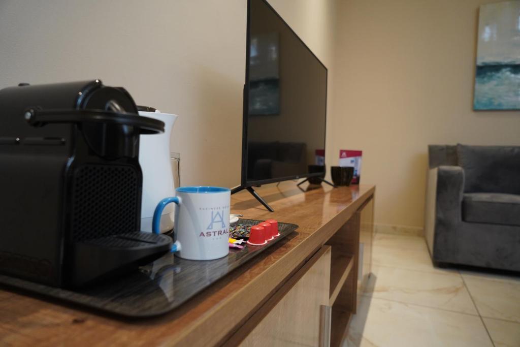TV a/nebo společenská místnost v ubytování HOTEL ASTRAL