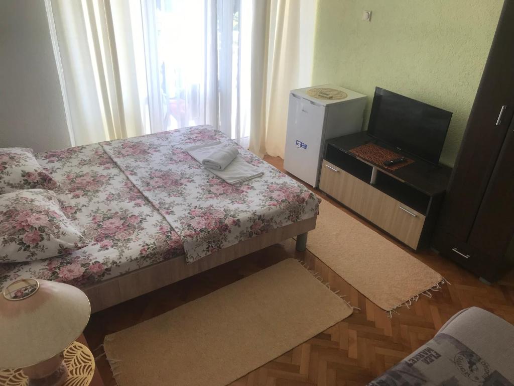 Postel nebo postele na pokoji v ubytování Tina Rooms