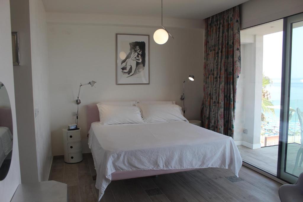 Postel nebo postele na pokoji v ubytování La Casa Del Mare