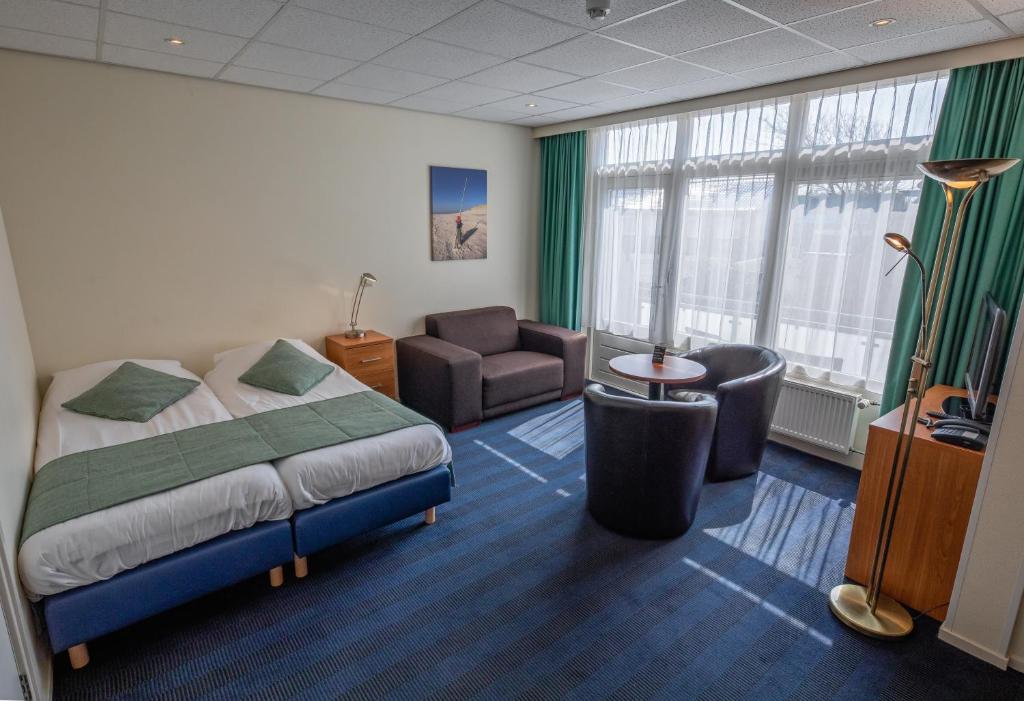 Postel nebo postele na pokoji v ubytování Hotel de Branding