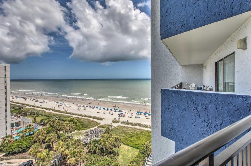 a view of the beach from the balcony of a hotel at 10th-Floor Condo on Myrtle Beach with Pools! in Myrtle Beach