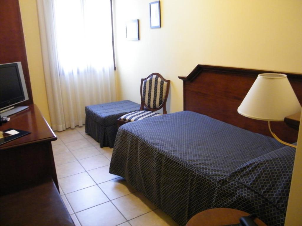 Postel nebo postele na pokoji v ubytování Locanda La Comacina