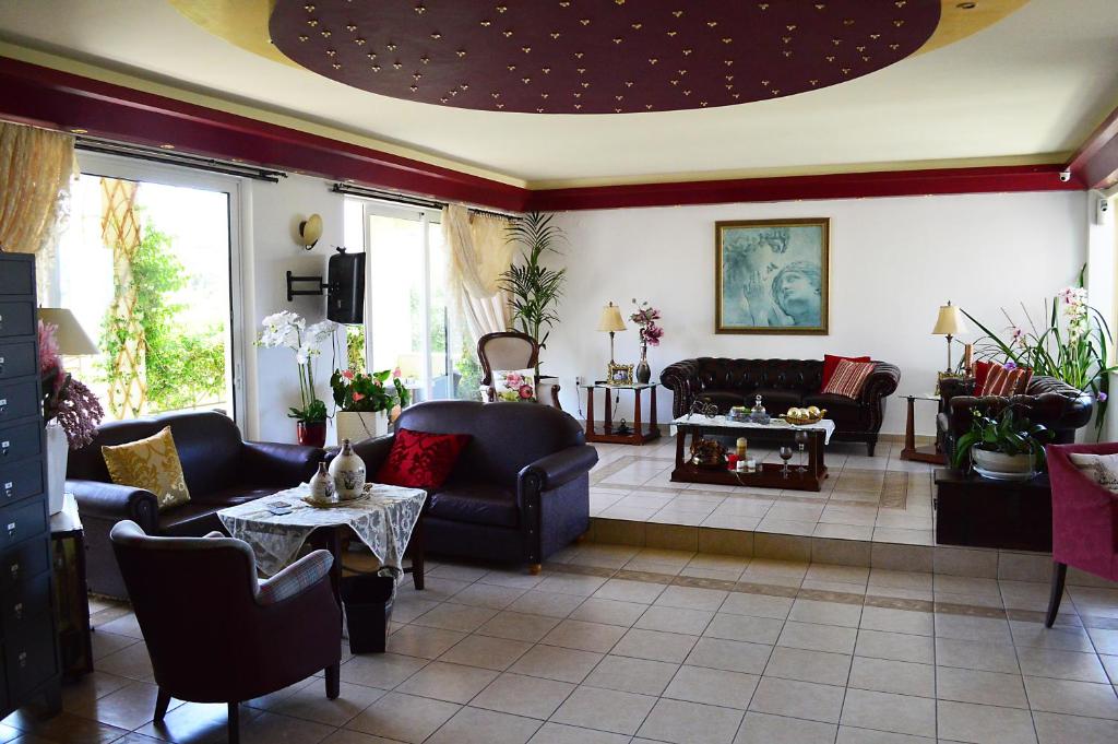 Posezení v ubytování Alexandros Hotel