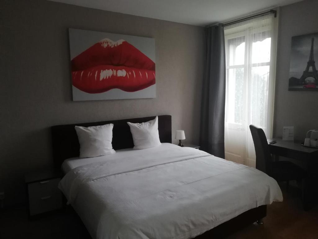 Uma cama ou camas num quarto em Hotel Parc & Lac