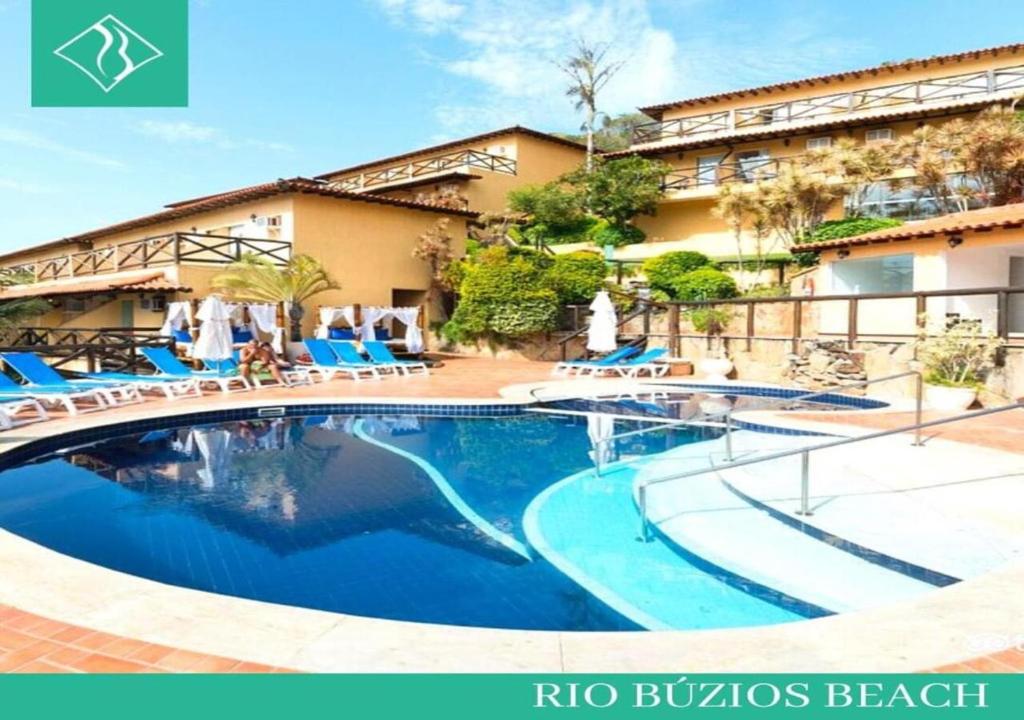 a swimming pool in front of a hotel at Rio Búzios Beach Hotel in Búzios
