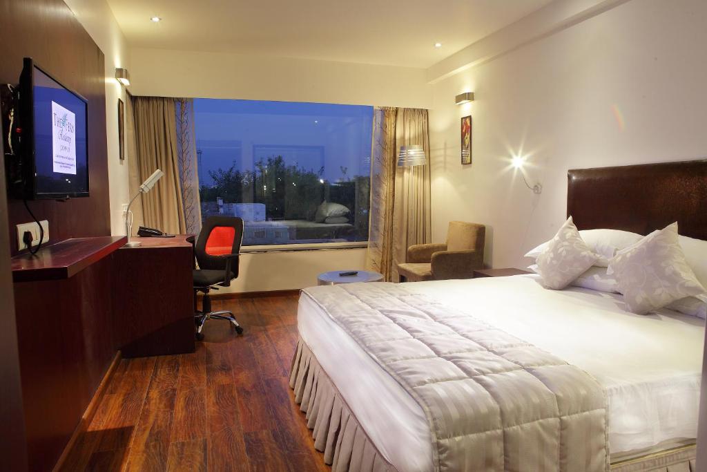 Ένα ή περισσότερα κρεβάτια σε δωμάτιο στο Fern Residency Jodhpur