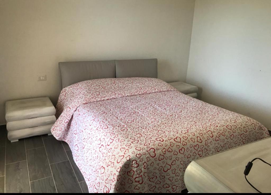 Кровать или кровати в номере Appartamento indipendente