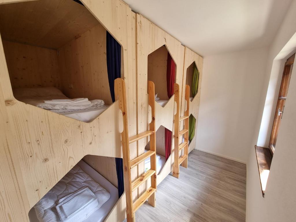 a group of bunk beds in a room at Stanton Hostel in Sankt Anton am Arlberg