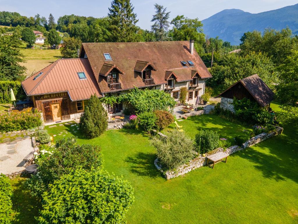 an aerial view of a house with a yard at Maison d'hôtes La Bageatière - Lac d'Aiguebelette in Lepin-le-Lac