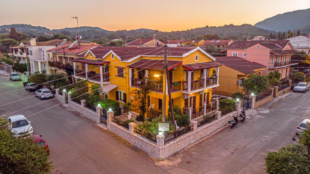 a group of houses on a street in a town at Corfu Dream Fani in Ýpsos