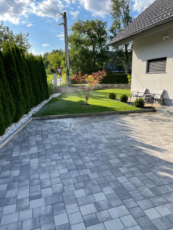 a driveway in a yard with a house at Rooms Minka in Kamna Gorica