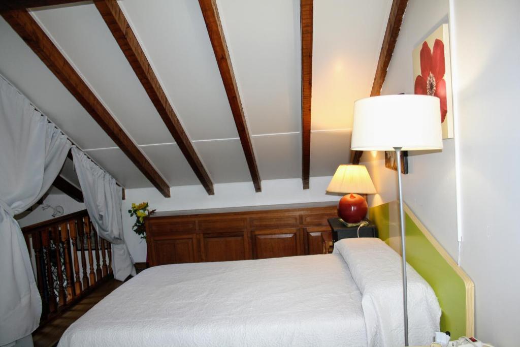 Postel nebo postele na pokoji v ubytování Casa la palmera