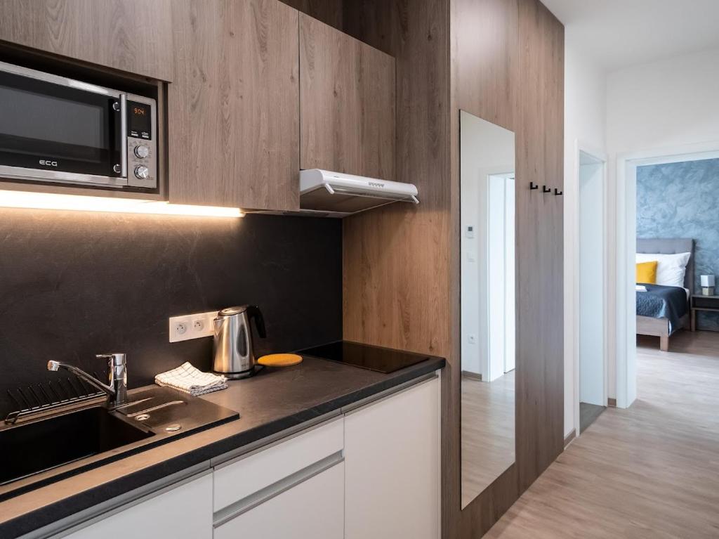 Kuchyň nebo kuchyňský kout v ubytování Wellness Apartmány Panorama