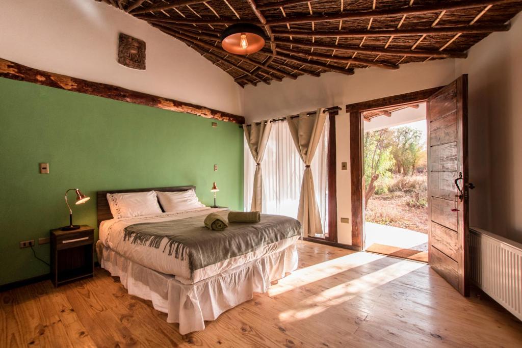 Postel nebo postele na pokoji v ubytování Lodge Atacama Horse