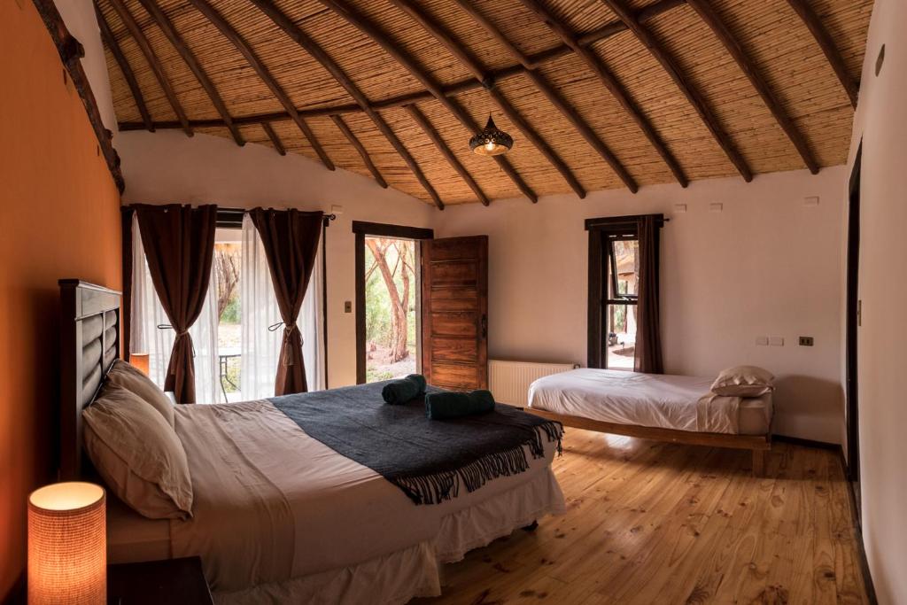 Postel nebo postele na pokoji v ubytování Lodge Atacama Horse