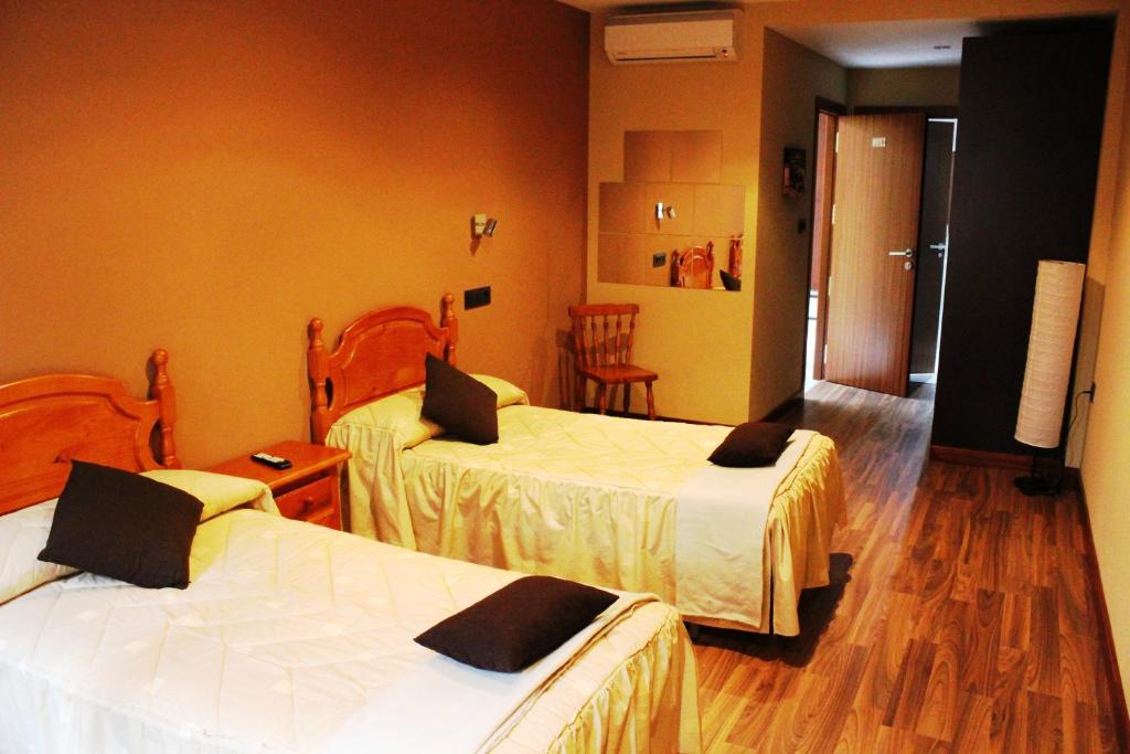 Posteľ alebo postele v izbe v ubytovaní Hostal Extremeño