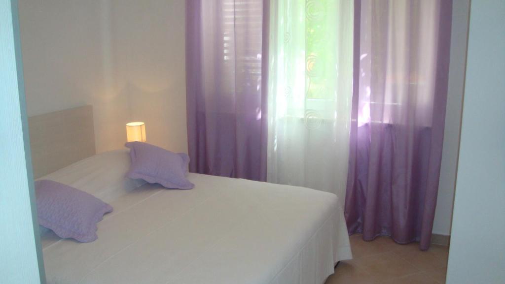Postel nebo postele na pokoji v ubytování Apartments Topo