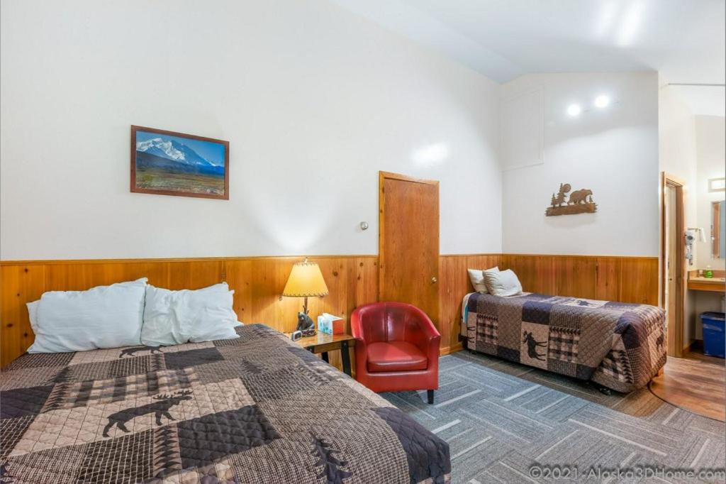 Postel nebo postele na pokoji v ubytování Backwoods Lodge