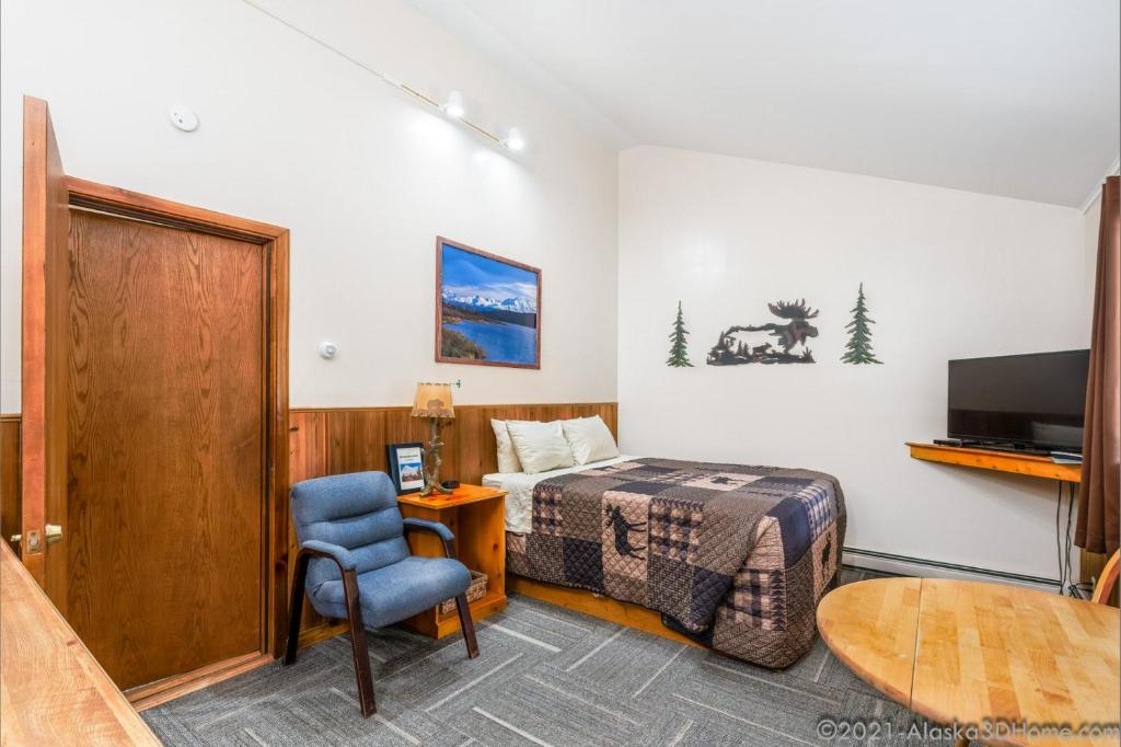 TV a/nebo společenská místnost v ubytování Backwoods Lodge