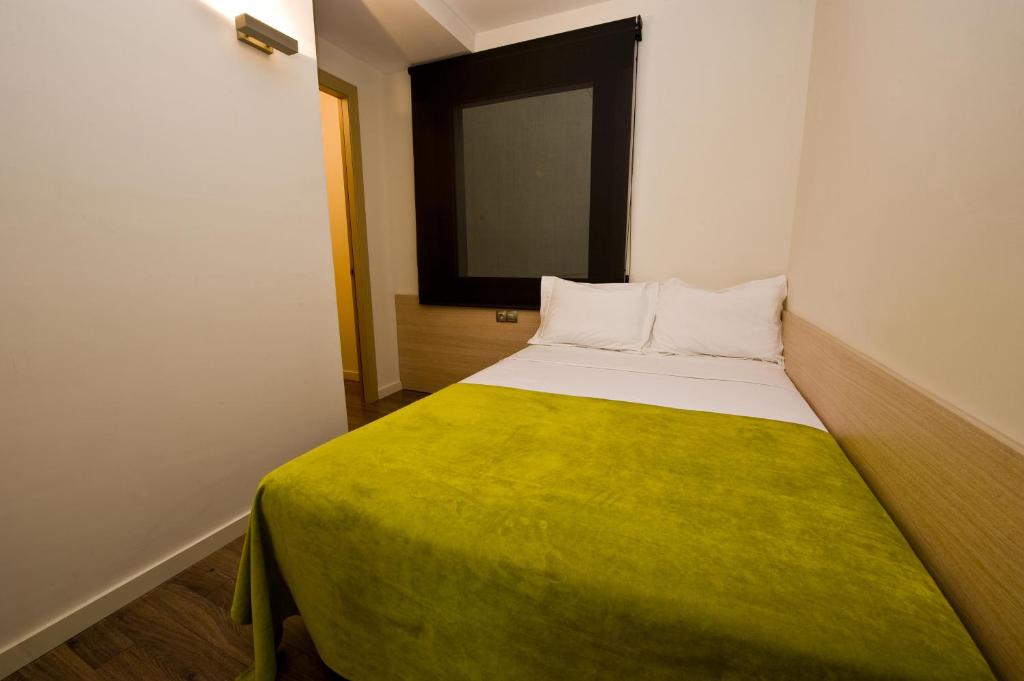 Postel nebo postele na pokoji v ubytování Casp 74 Apartments