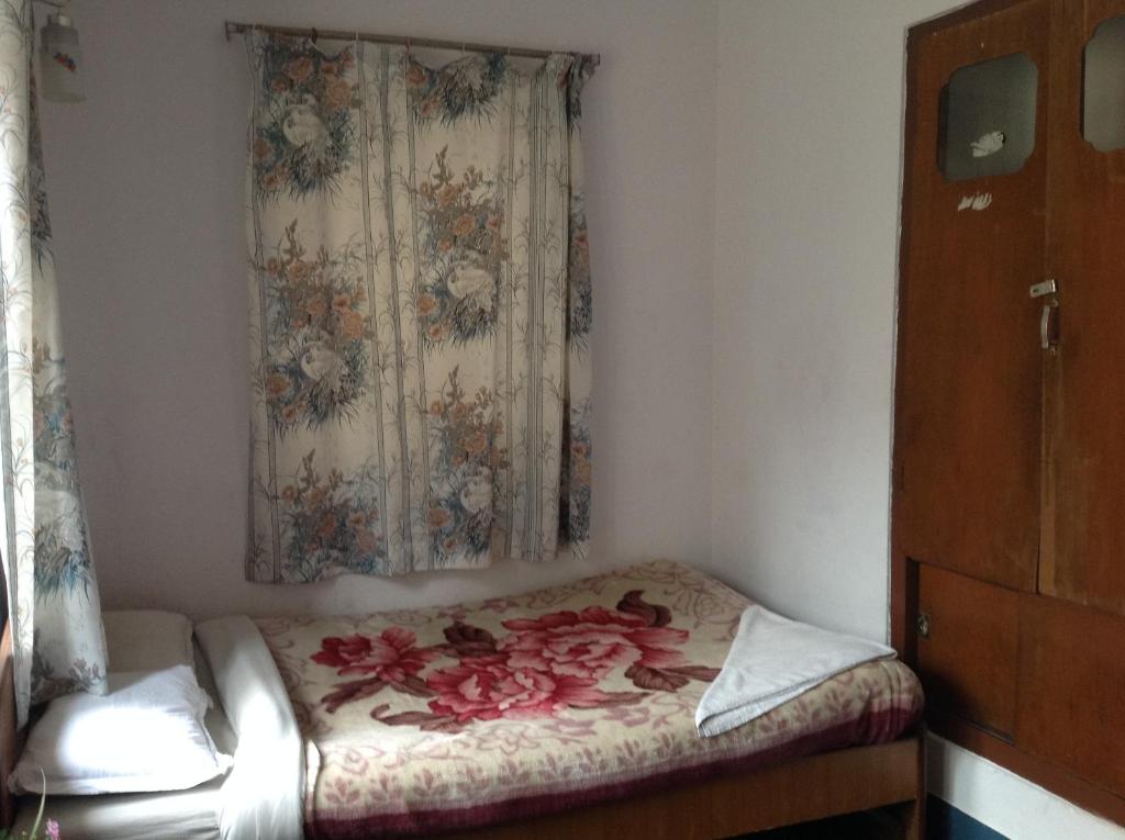 Postel nebo postele na pokoji v ubytování Hotel Down Town