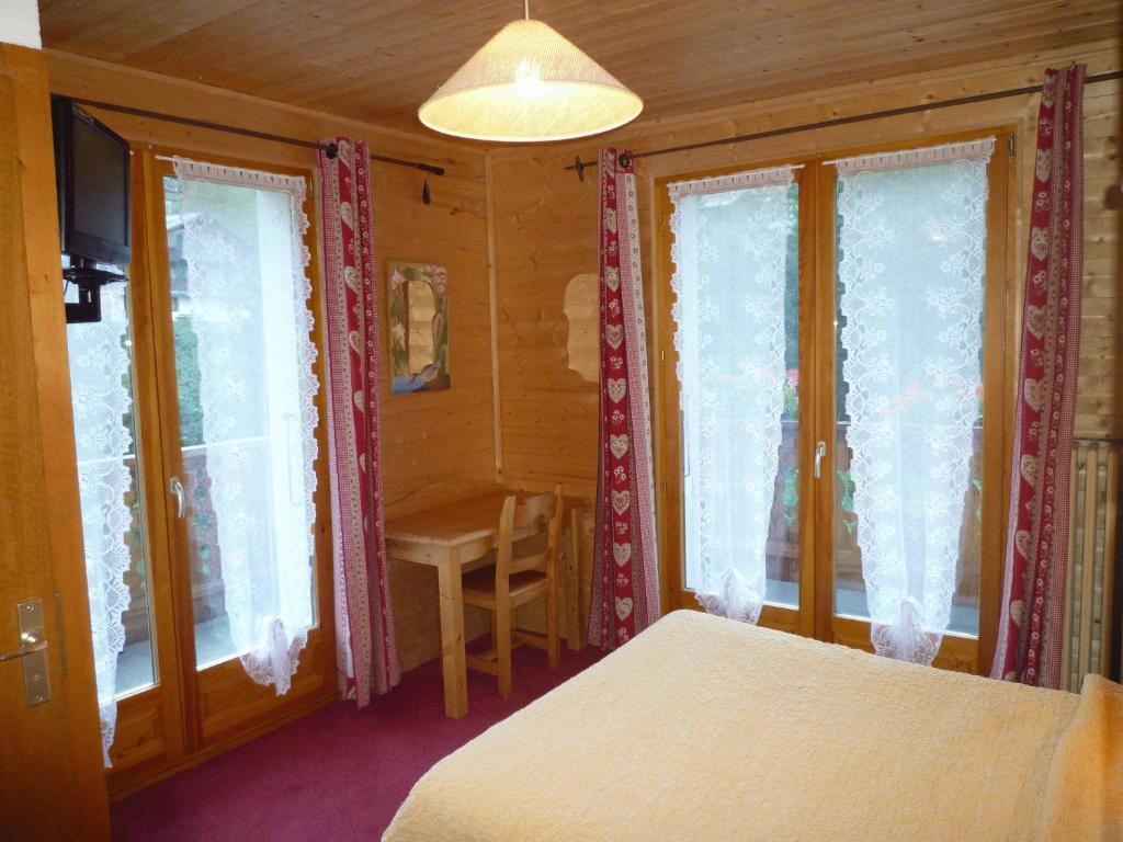 Postel nebo postele na pokoji v ubytování Hôtel Le Kandahar