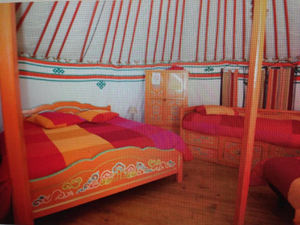 Postel nebo postele na pokoji v ubytování Camping Domaine de Mepillat