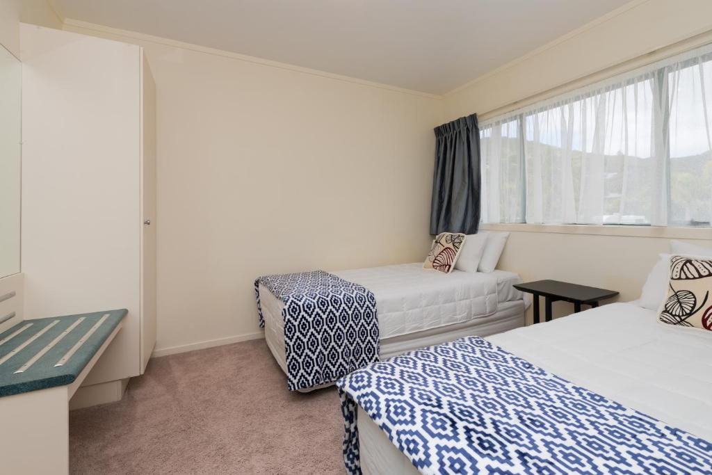 Postel nebo postele na pokoji v ubytování Te Tiriti Motel