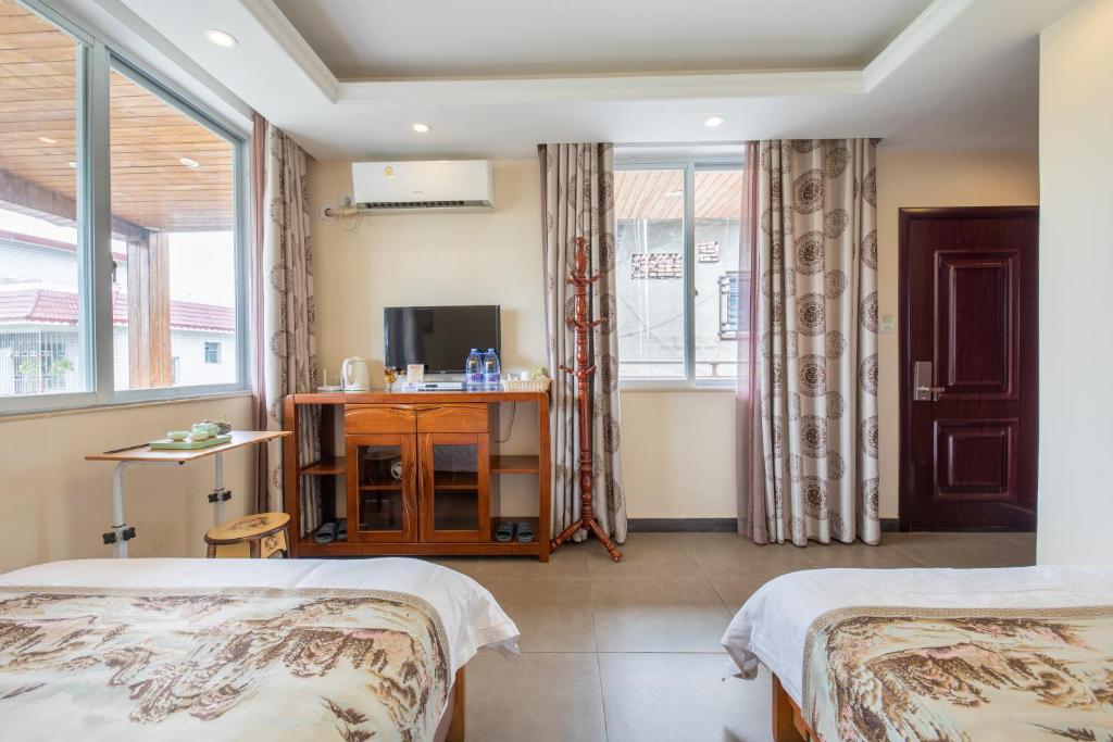 Postel nebo postele na pokoji v ubytování Junshe Boutique Guest House-Complementary pick up servie for a 3-night stay in a deluxe room