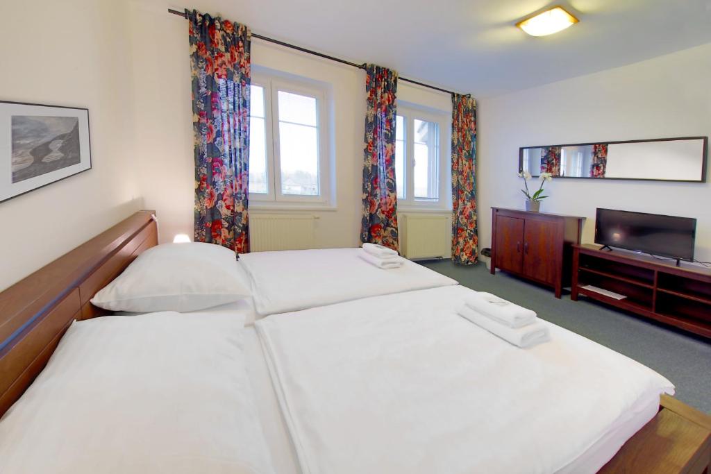 Postel nebo postele na pokoji v ubytování Hotel BRADA