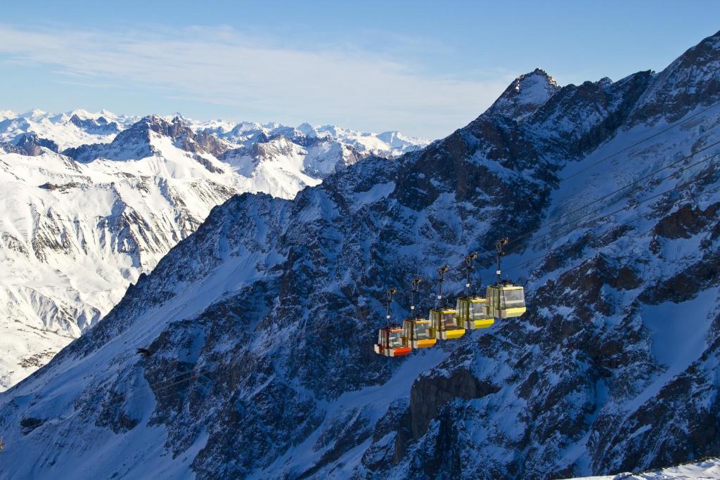 an aerial view of a mountain with snow covered mountains at Hotel Le Faranchin in Villar-dʼArène
