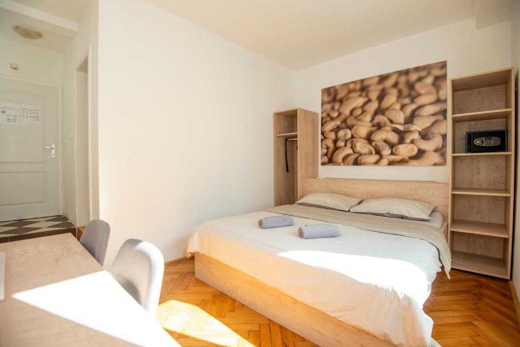 Postel nebo postele na pokoji v ubytování Viva Rooms