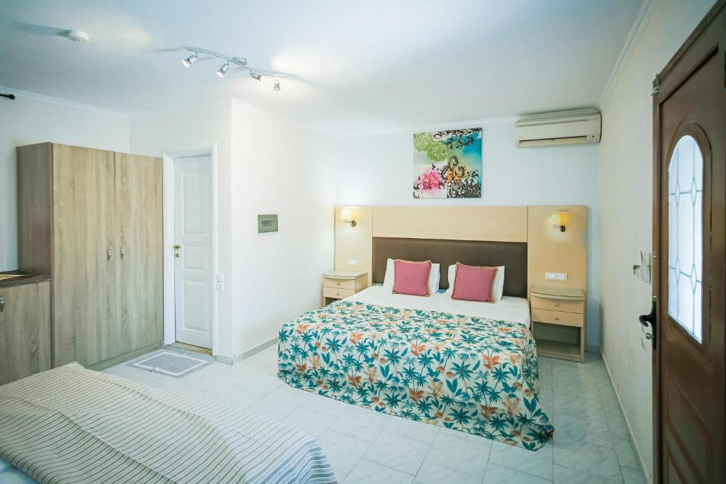 Postel nebo postele na pokoji v ubytování Rose Club Apartments