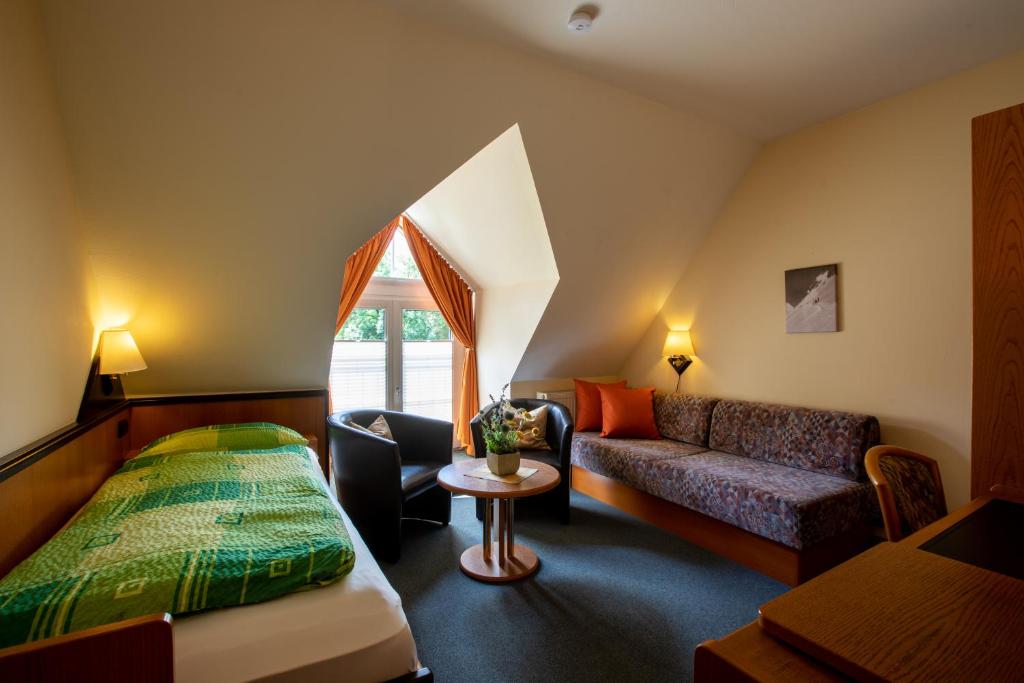 Postel nebo postele na pokoji v ubytování Hotel Brückenschänke