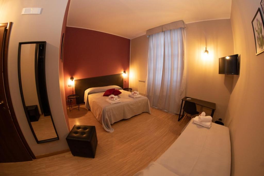 Posteľ alebo postele v izbe v ubytovaní Hotel Marconi