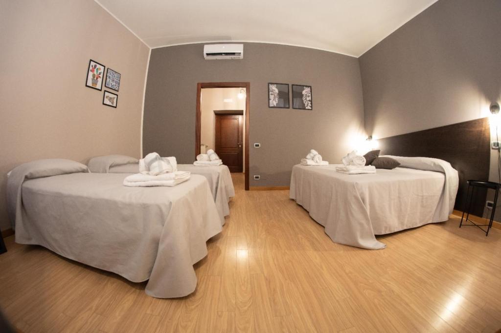 Posteľ alebo postele v izbe v ubytovaní Hotel Marconi