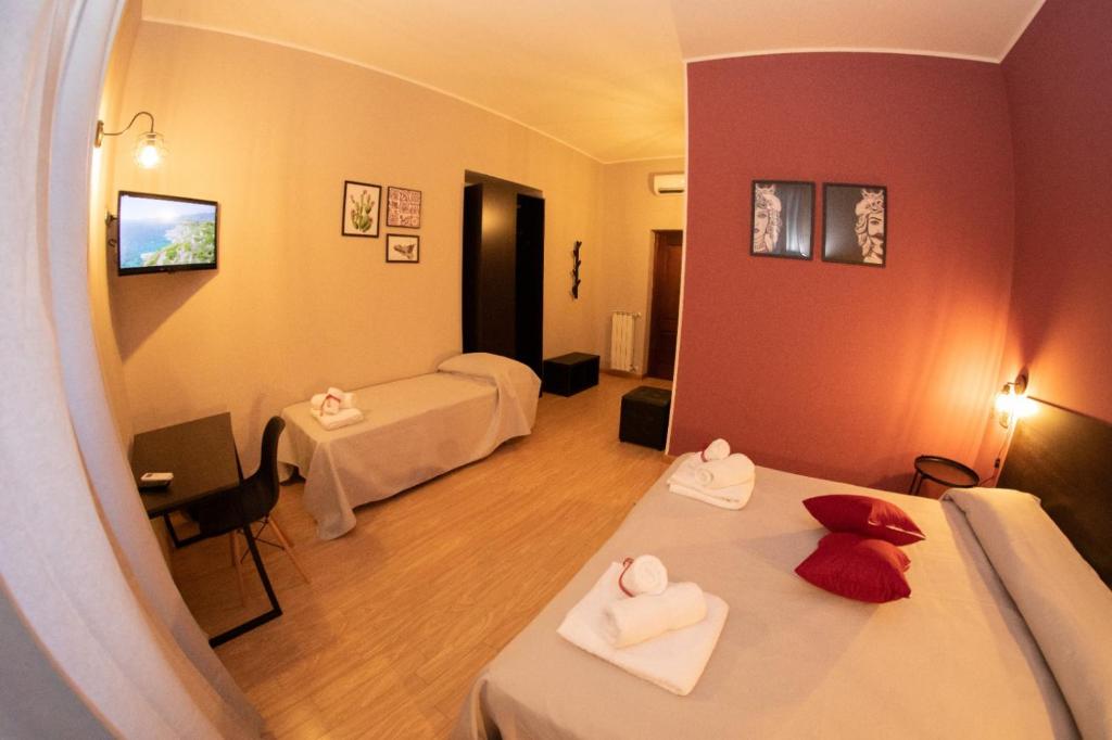 Posteľ alebo postele v izbe v ubytovaní Hotel Marconi