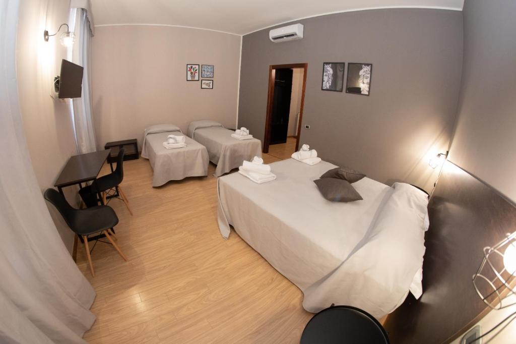 Posteľ alebo postele v izbe v ubytovaní Hotel Marconi