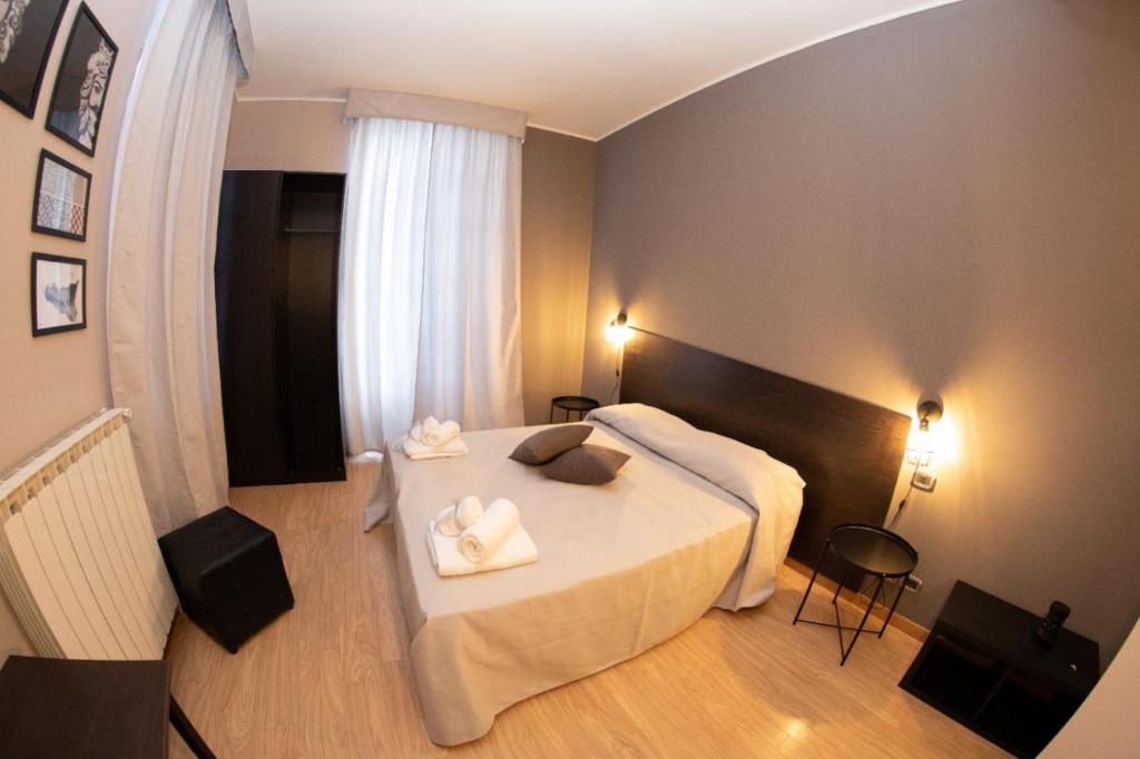 Posteľ alebo postele v izbe v ubytovaní Hotel Marconi