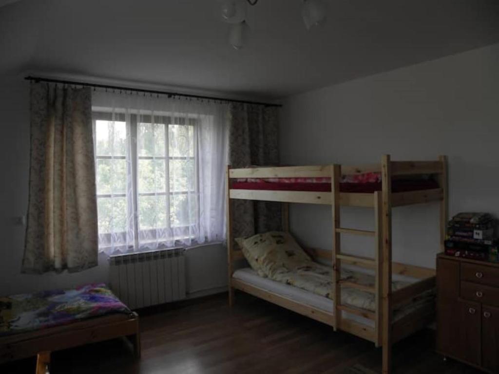 Posteľ alebo postele v izbe v ubytovaní Siedlisko Pauza