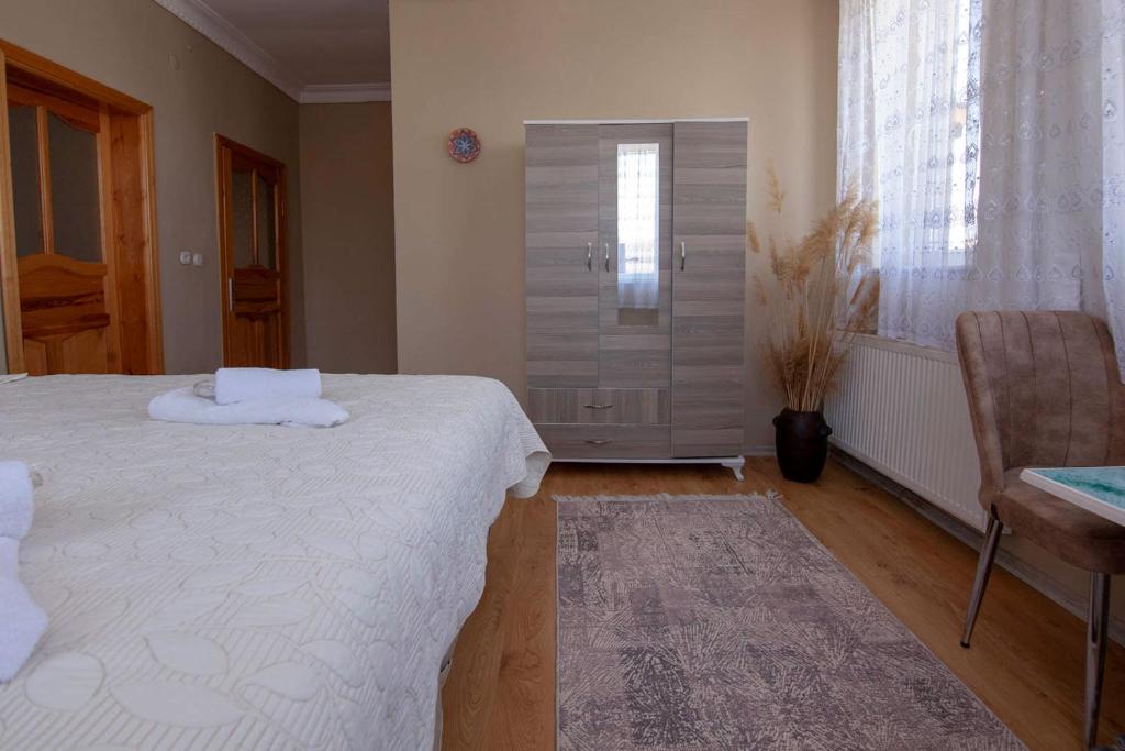 Postel nebo postele na pokoji v ubytování Sevin Stone Hotel