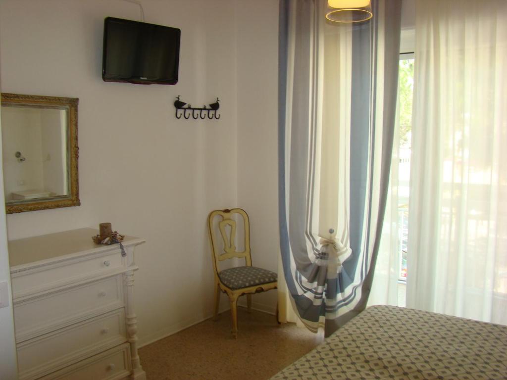 Postel nebo postele na pokoji v ubytování Hotel Tizian Beach