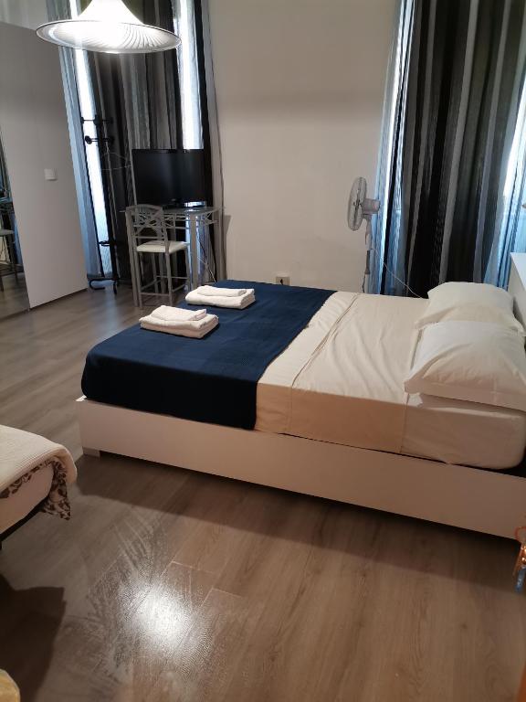 Posteľ alebo postele v izbe v ubytovaní B&B Porto Vecchio ROOMS - Stazione Centrale Trieste