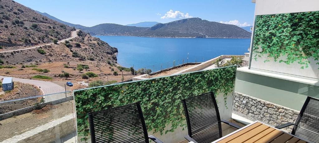 a building with a view of a body of water at Caldera Blue in Alikí