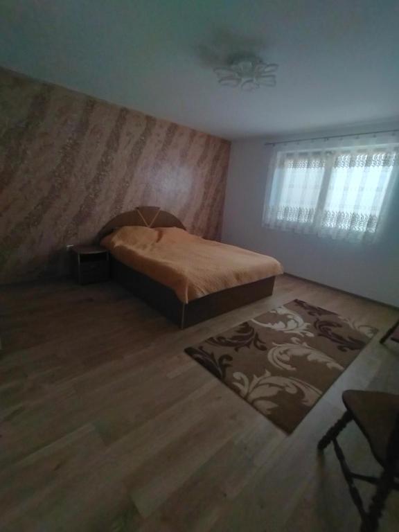 Postel nebo postele na pokoji v ubytování Casa Luminița