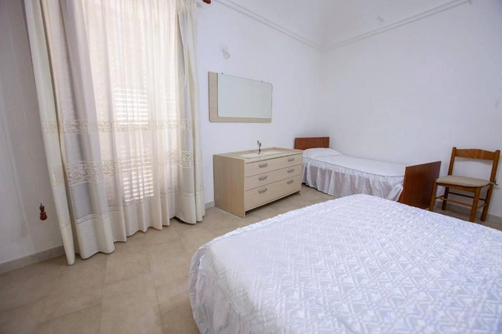 Łóżko lub łóżka w pokoju w obiekcie Casa Terranova Modica