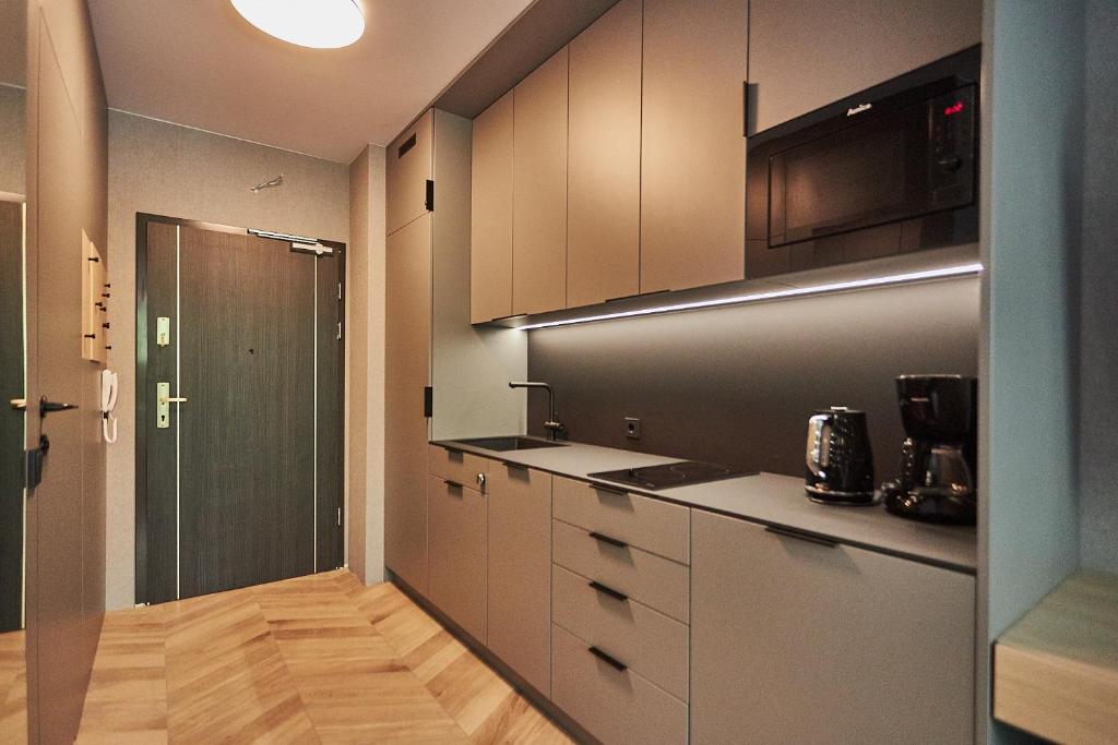 Kuchyňa alebo kuchynka v ubytovaní Apartamenty Świnoujście - Lividus 323